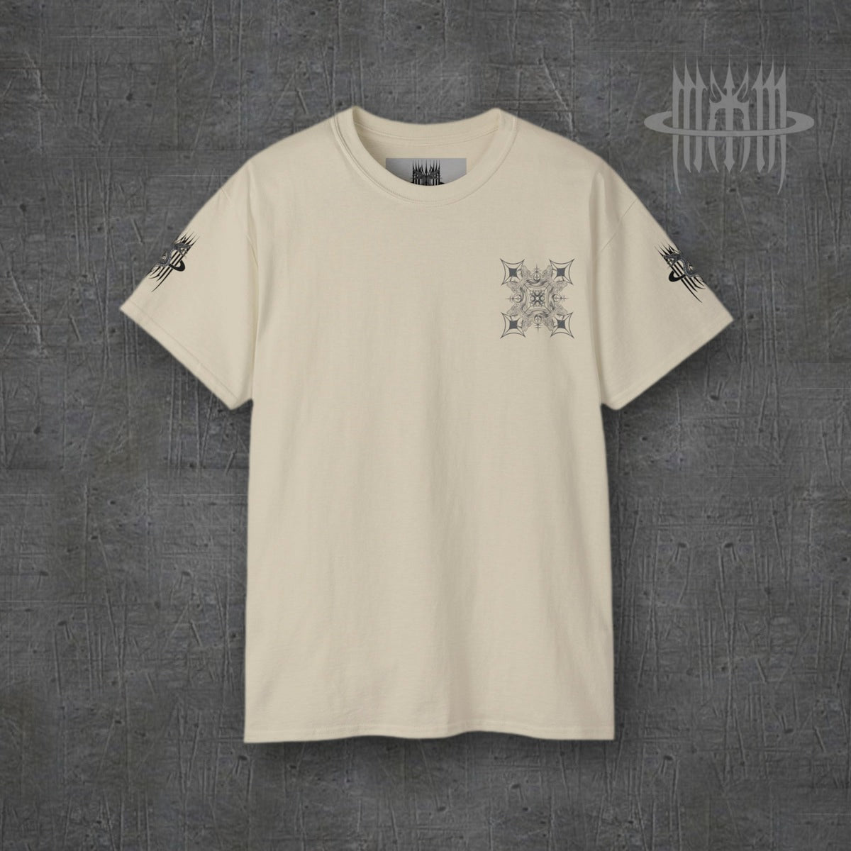 MK0KM Sphinx Cat Gothic Cross Unisex Cotton T-Shirt – sand, front view, dark concrete background