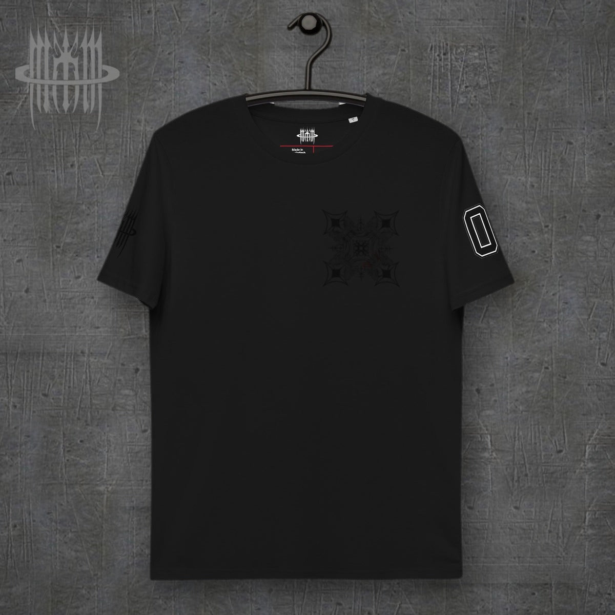 MK0KM NKLA unisex organic cotton t-shirt – front view, dark concrete background