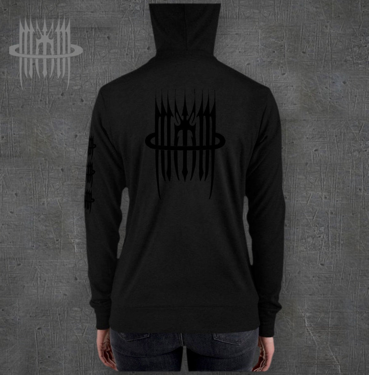 MK0KM Unisex xxx zip hoodie – model back view, dark concrete background