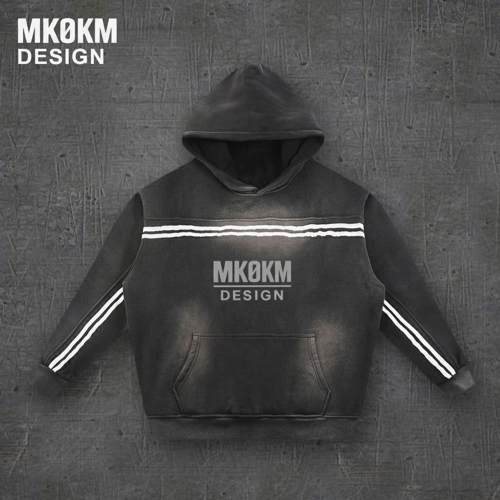 MK0KM Sun Fade Contrast Tape Fleece Hoodie – front view, dark concrete background