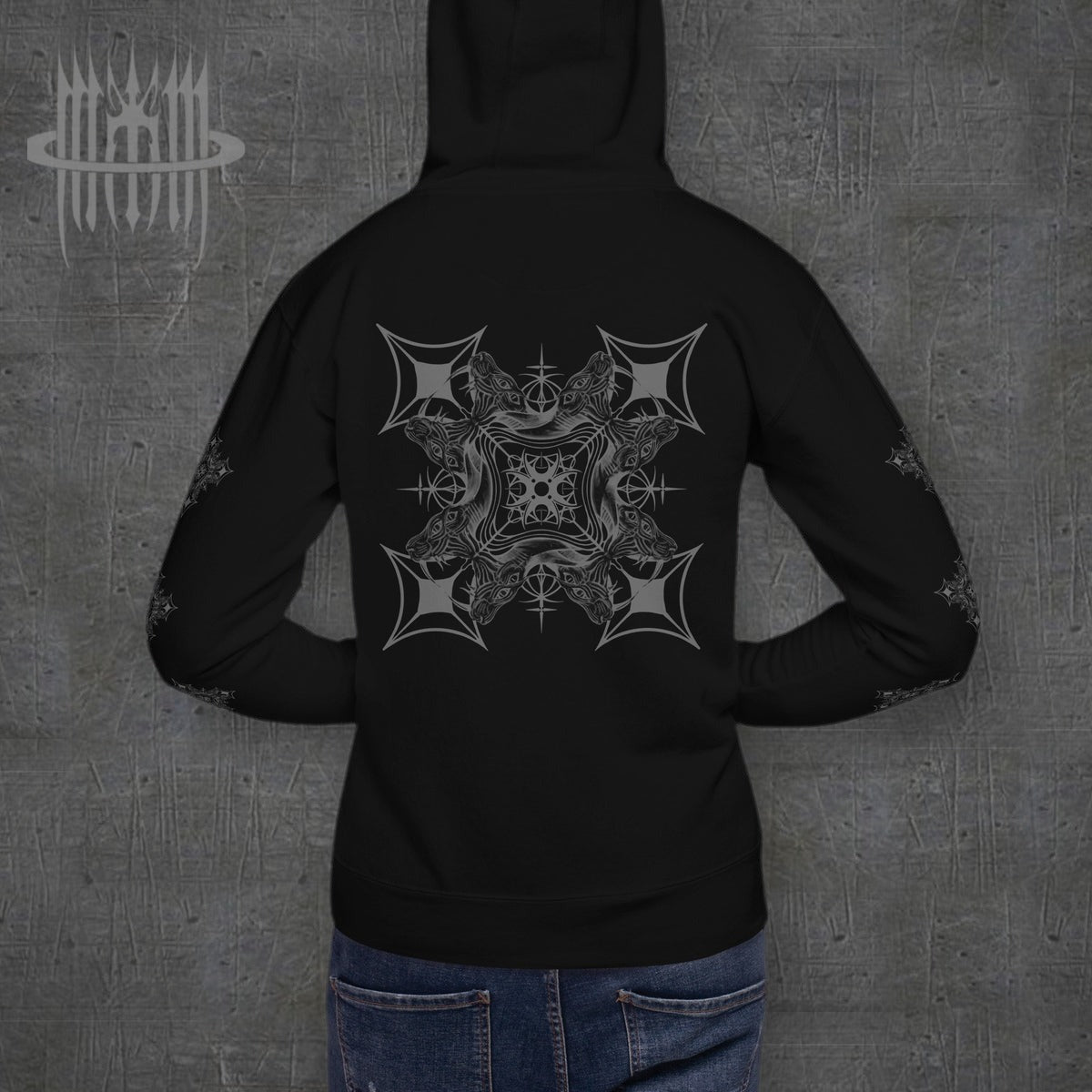 MK0KM Unisex Hoodie – black, model back view, dark concrete background